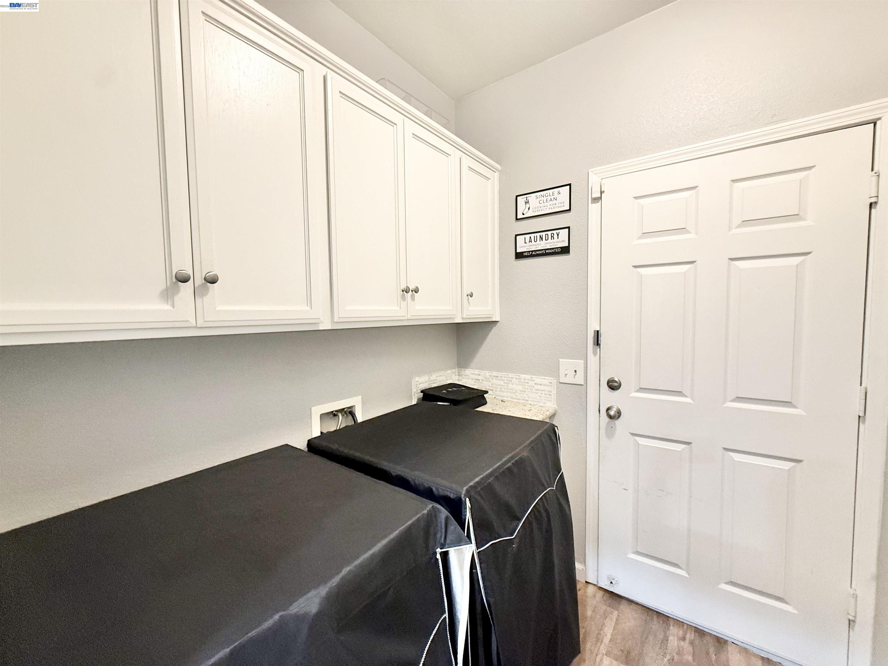 2408 Mountain Pride Court Modesto, CA 95355 - Photo 18 of 25 a view of cabinets with wooden floor and cabinet