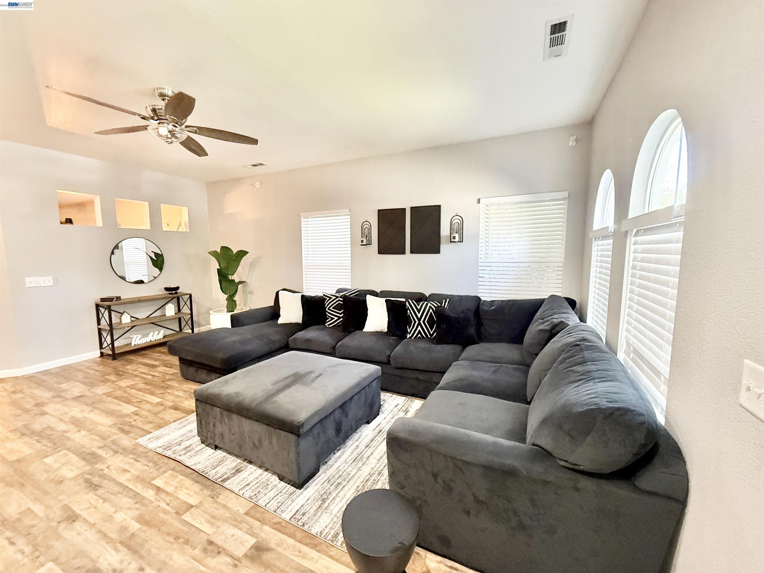 2408 Mountain Pride Court Modesto, CA 95355 - Photo 2 of 25 a living room with furniture and a window