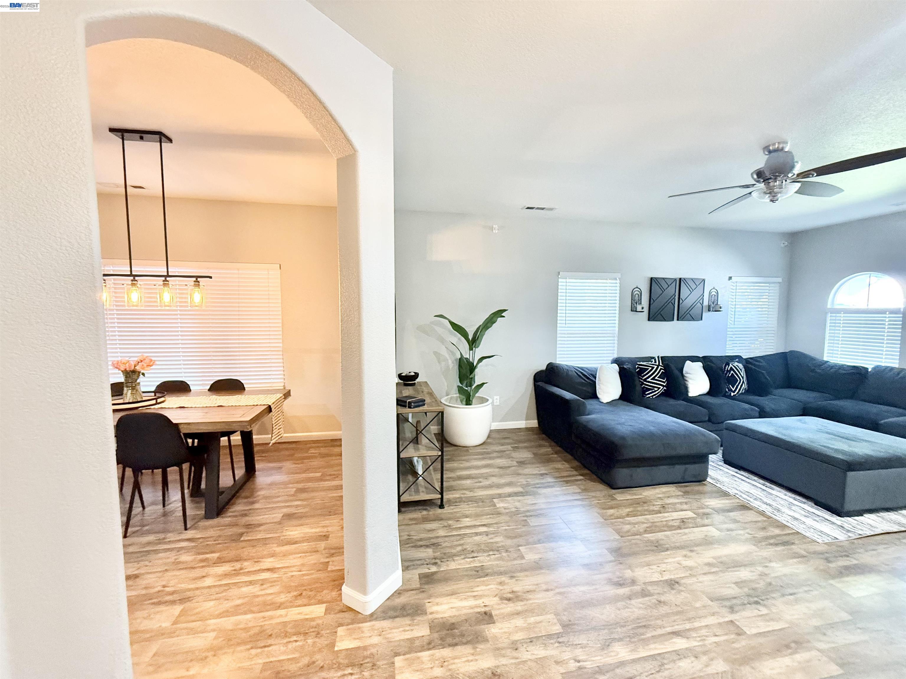 2408 Mountain Pride Court Modesto, CA 95355 - Photo 4 of 25 a living room with furniture and a large window