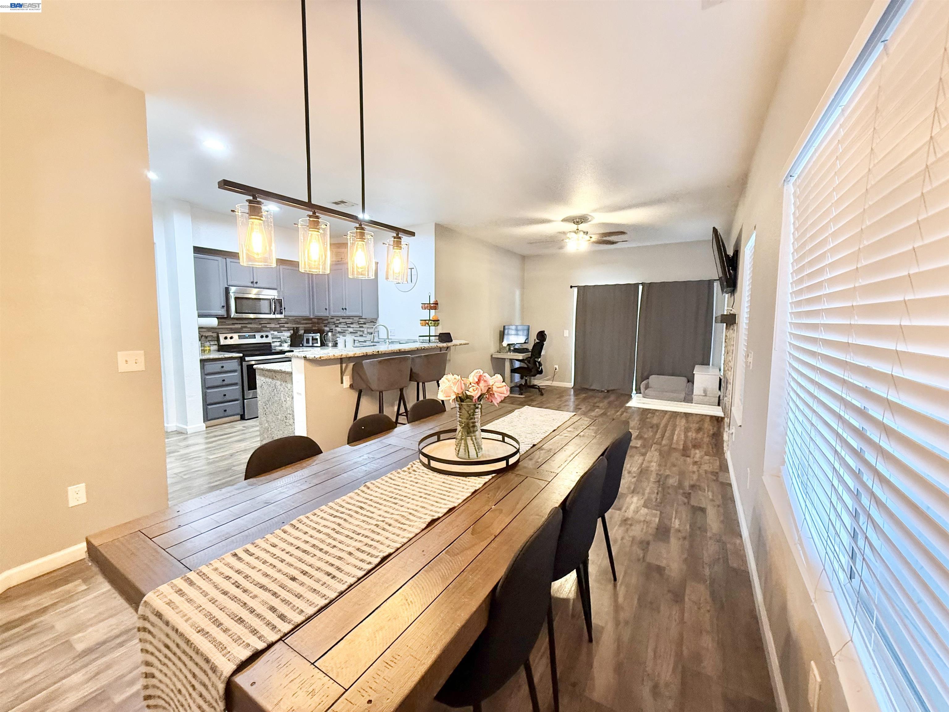 2408 Mountain Pride Court Modesto, CA 95355 - Photo 5 of 25 a kitchen with kitchen island granite countertop lots of counter top space and stainless steel appliances