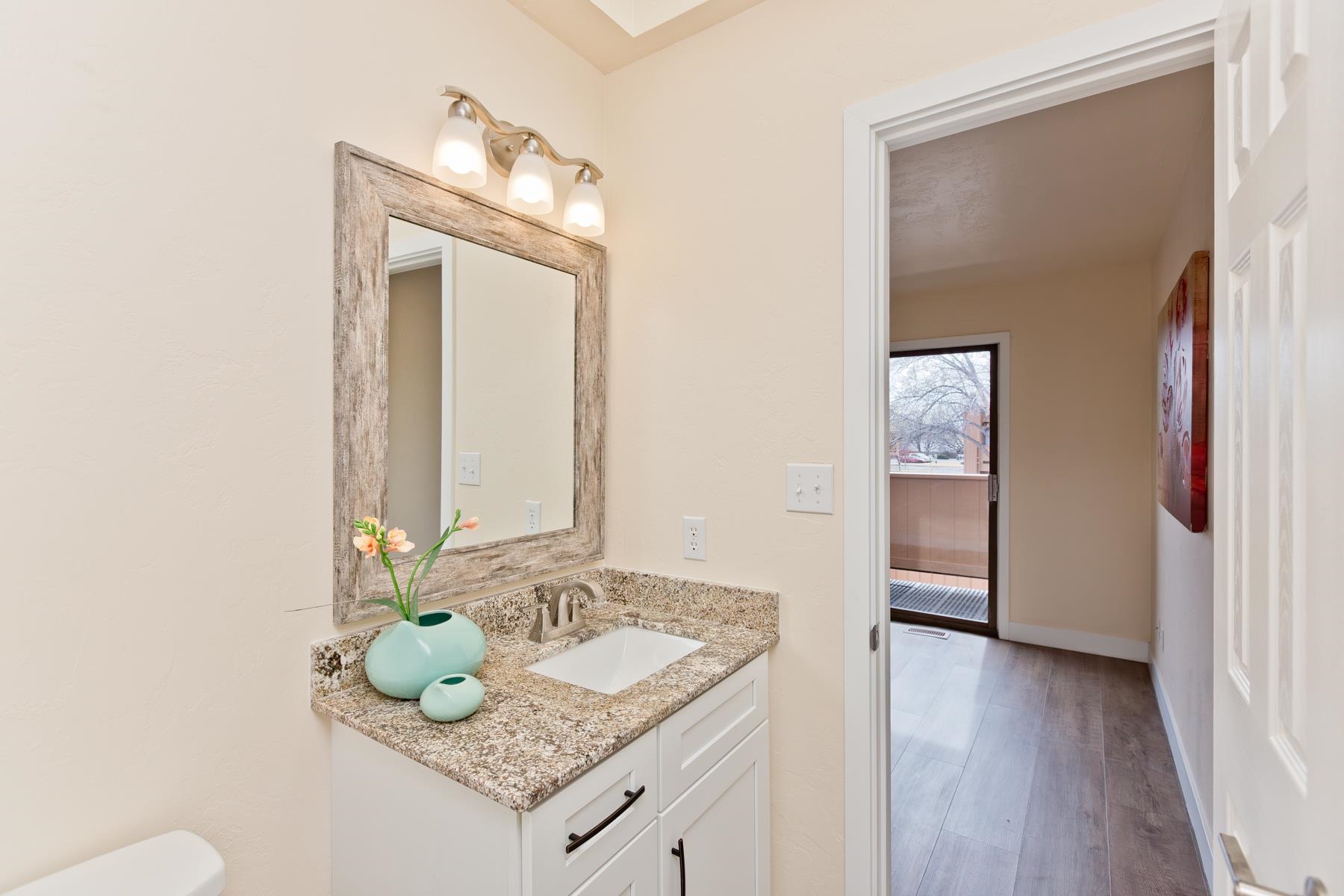 575-28 28 1/2 Road, Unit 44 Grand Junction, CO 81501 - Photo 15 of 39 a bathroom with a granite countertop sink and a mirror