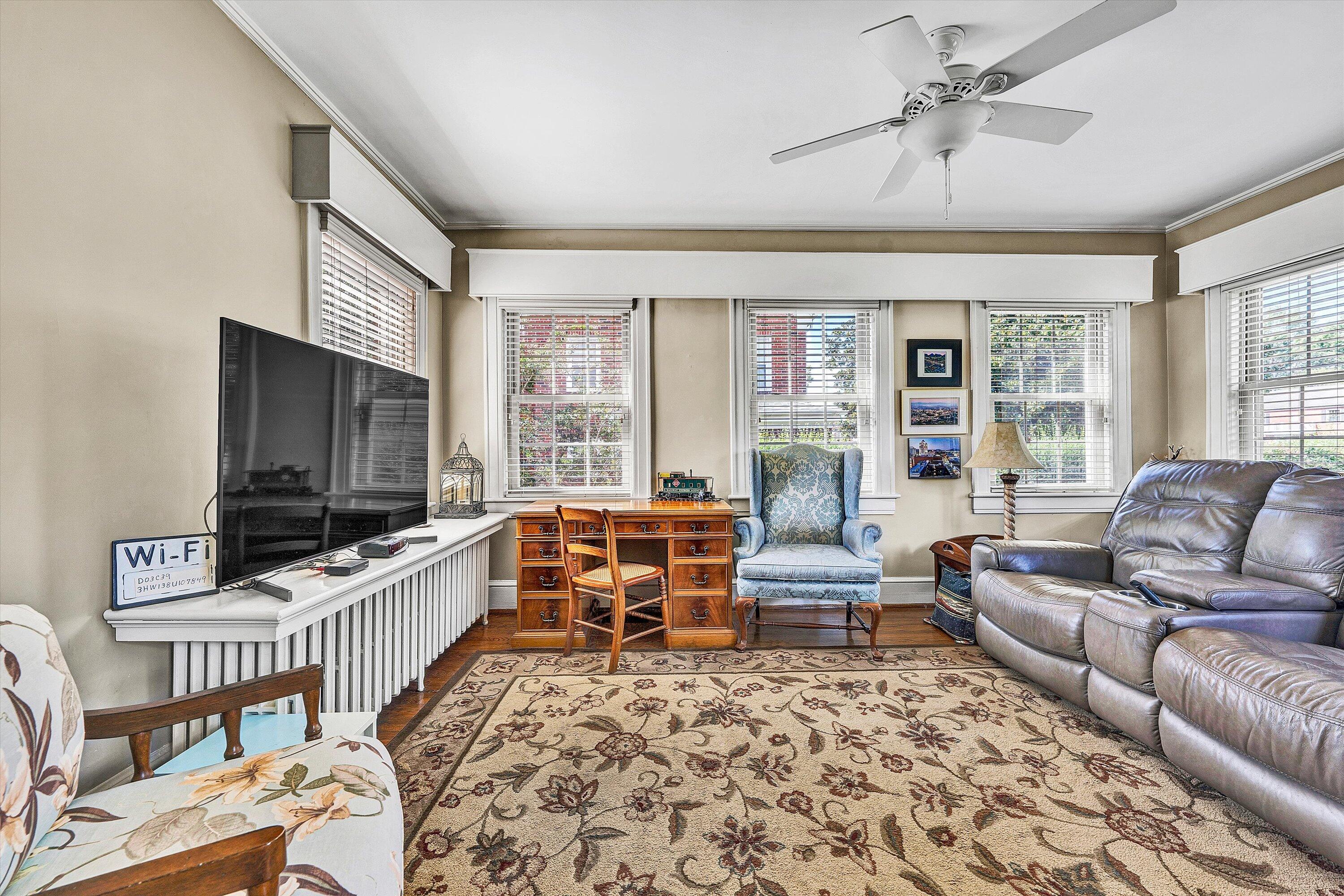 1930 Grandin Road Southwest Roanoke, VA 24015 - Photo 18 of 100 a living room with furniture and a flat screen tv