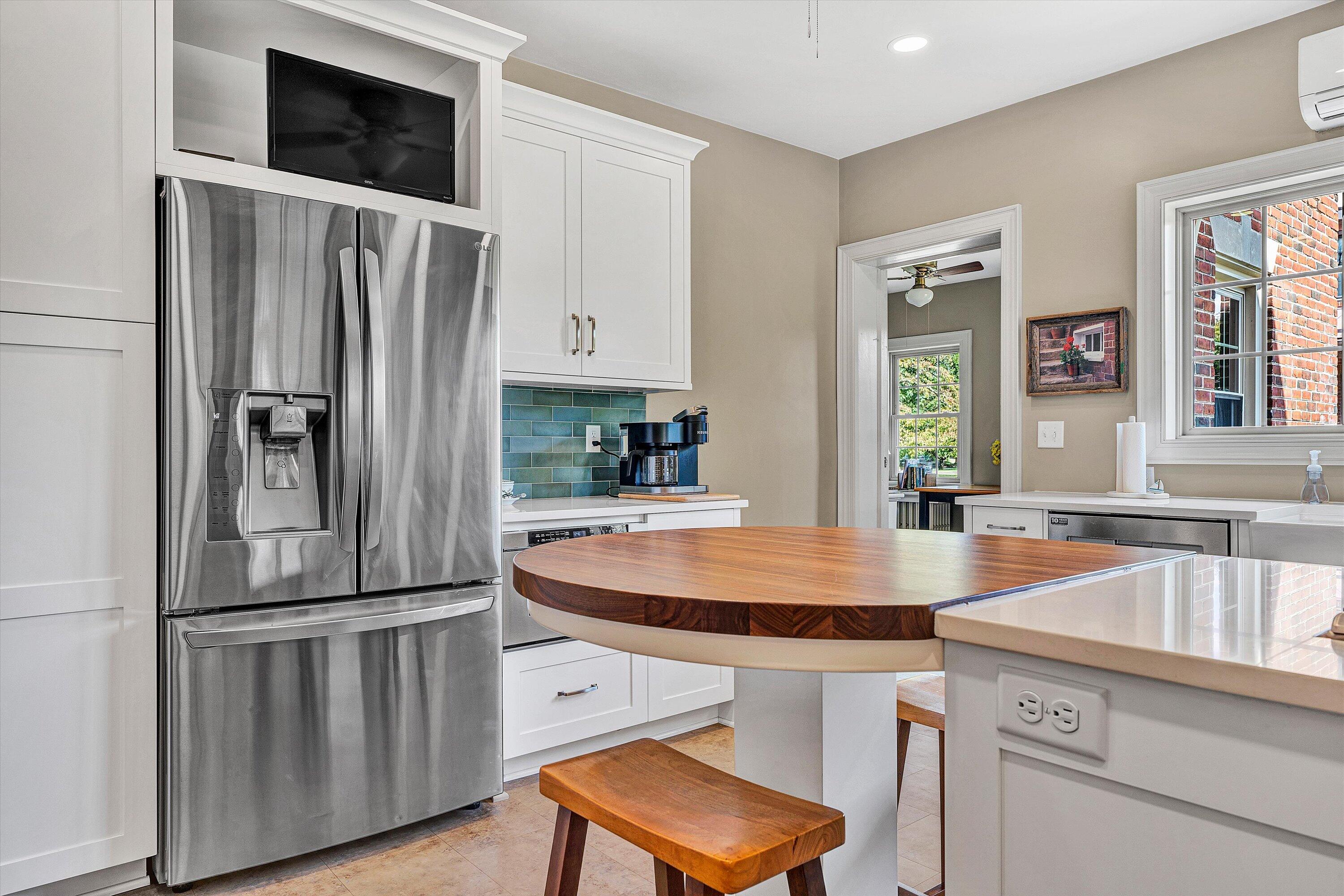 1930 Grandin Road Southwest Roanoke, VA 24015 - Photo 29 of 100 a kitchen with stainless steel appliances a refrigerator a sink a stove and cabinets
