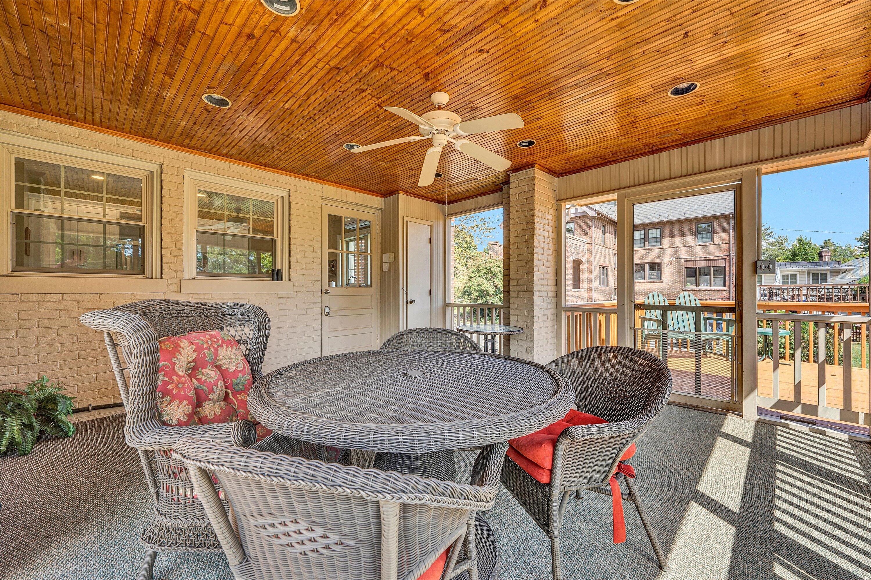 1930 Grandin Road Southwest Roanoke, VA 24015 - Photo 35 of 100 a view of a dining room with furniture large windows and wooden floor