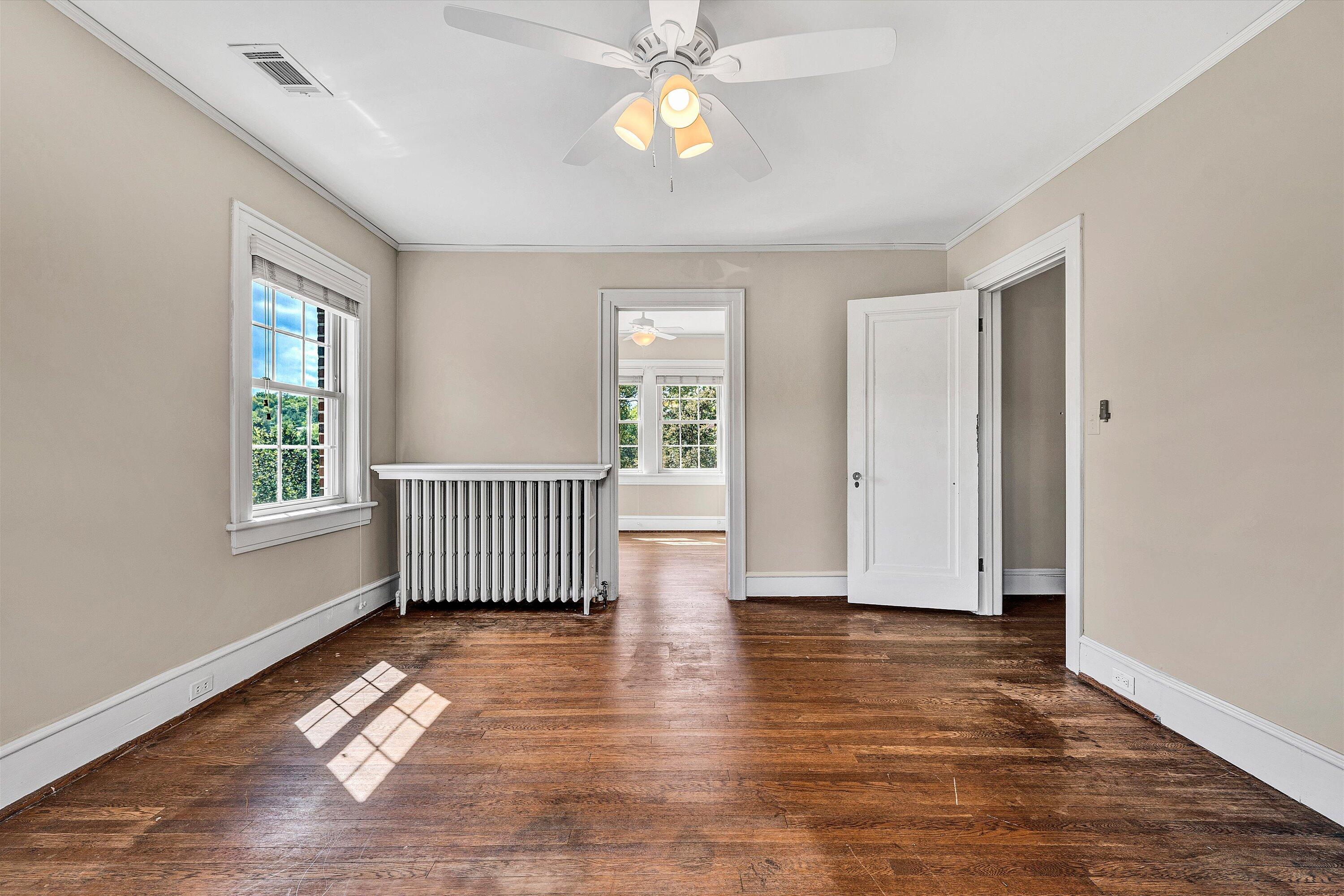 1930 Grandin Road Southwest Roanoke, VA 24015 - Photo 47 of 100 an empty room with wooden floor and windows