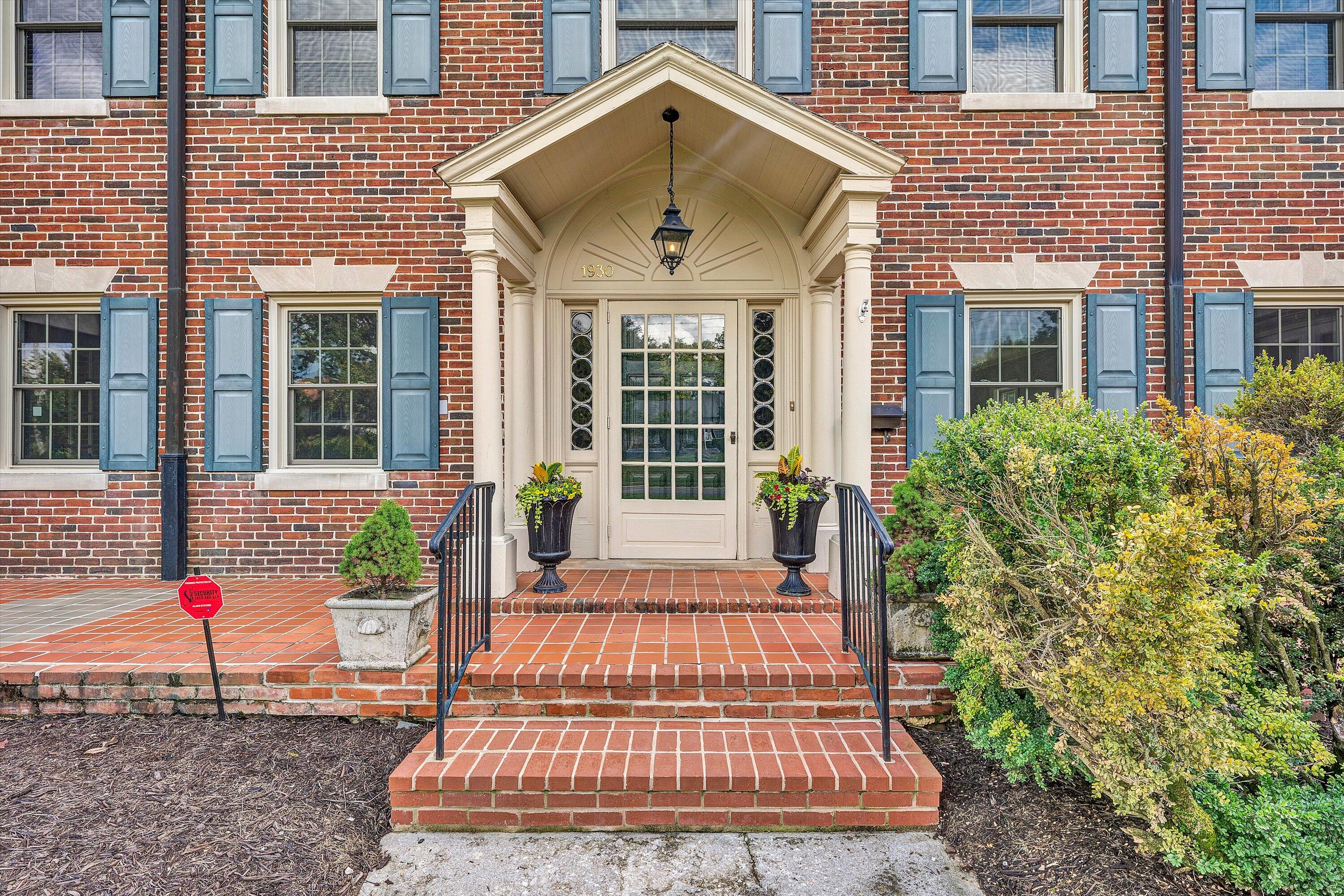 1930 Grandin Road Southwest Roanoke, VA 24015 - Photo 6 of 100 a front view of a house with a garden