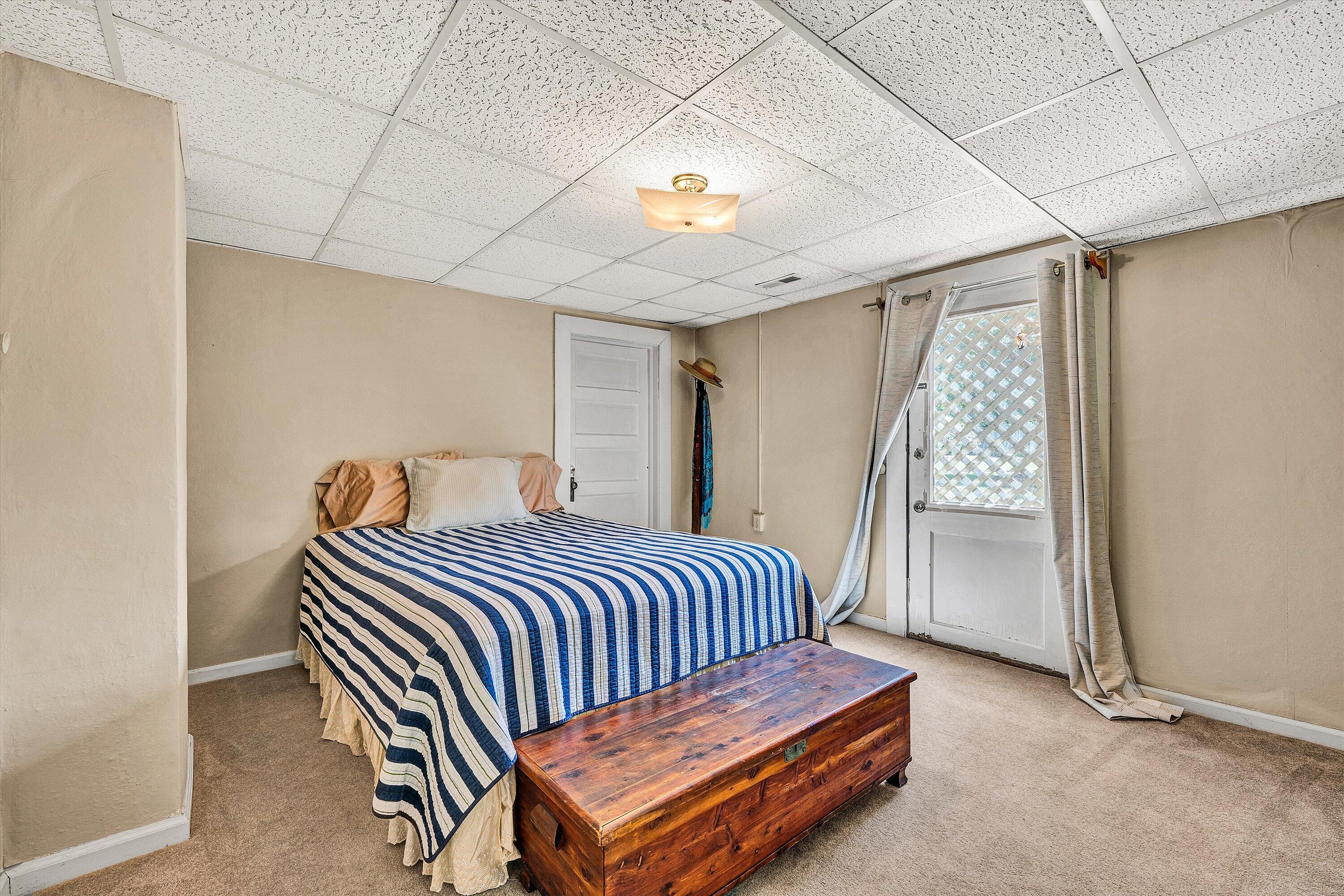 1930 Grandin Road Southwest Roanoke, VA 24015 - Photo 63 of 100 a bedroom with a bed and a chandelier