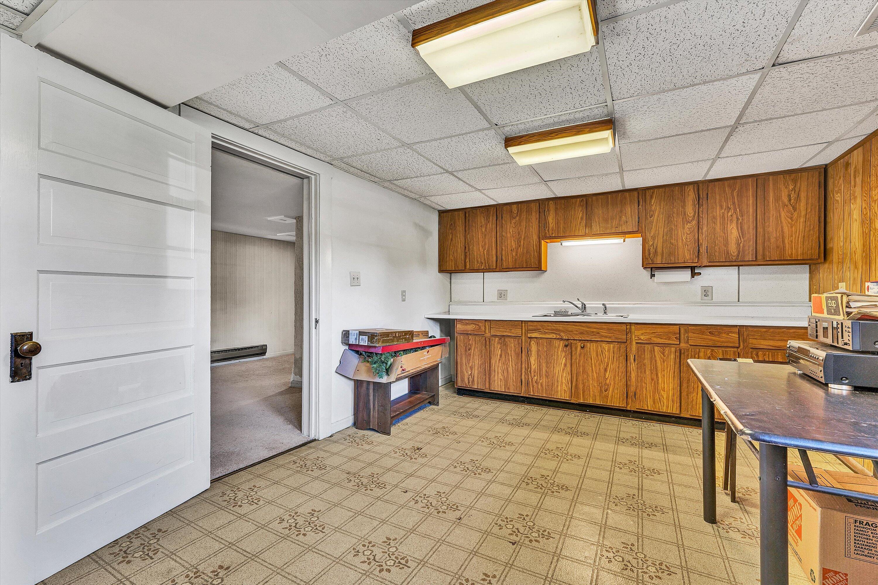 1930 Grandin Road Southwest Roanoke, VA 24015 - Photo 65 of 100 a kitchen with a stove a refrigerator and countertop