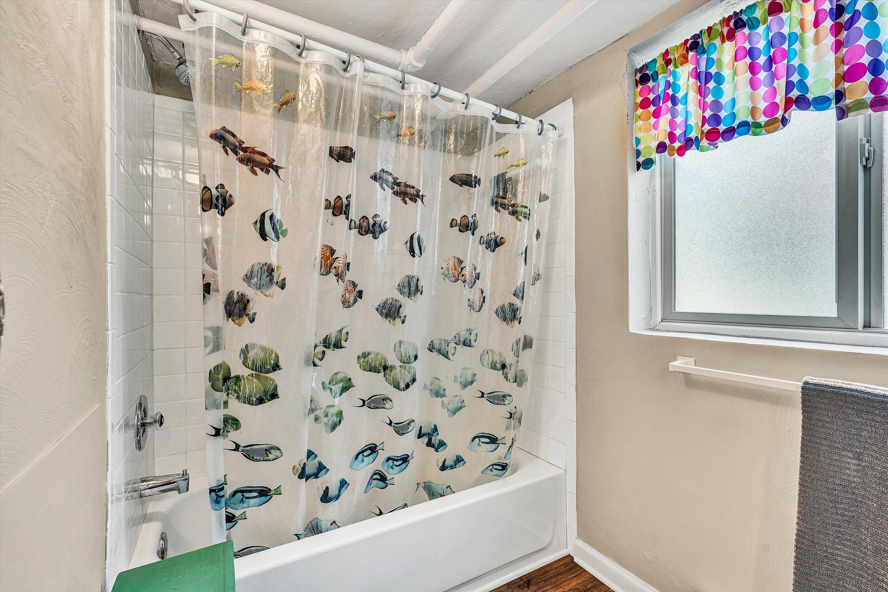 1930 Grandin Road Southwest Roanoke, VA 24015 - Photo 68 of 100 a bathroom with a bathtub and shower curtain