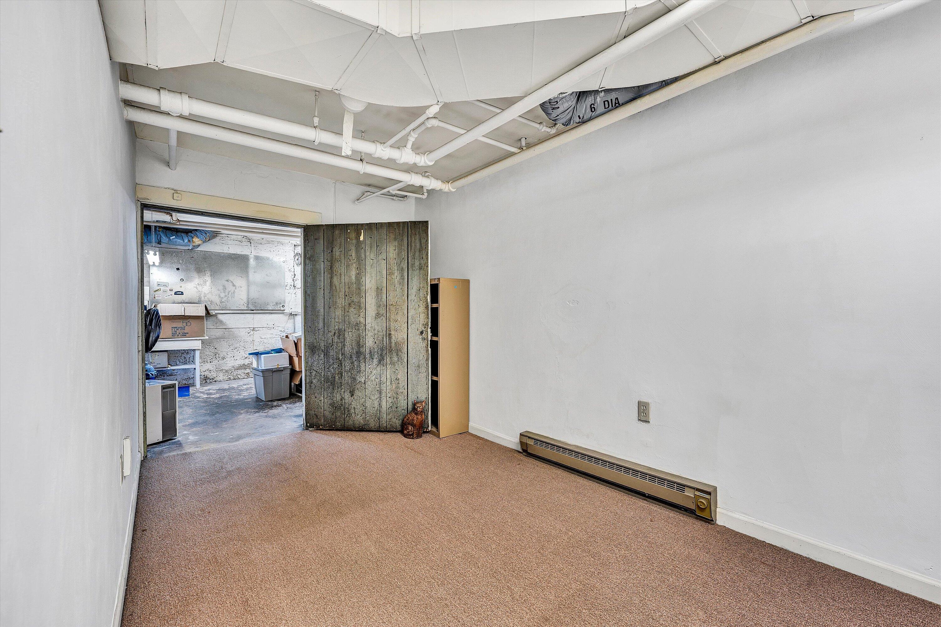 1930 Grandin Road Southwest Roanoke, VA 24015 - Photo 70 of 100 a view of a livingroom with wooden floor and a ceiling fan