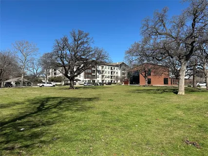 a front view of house with yard and trees