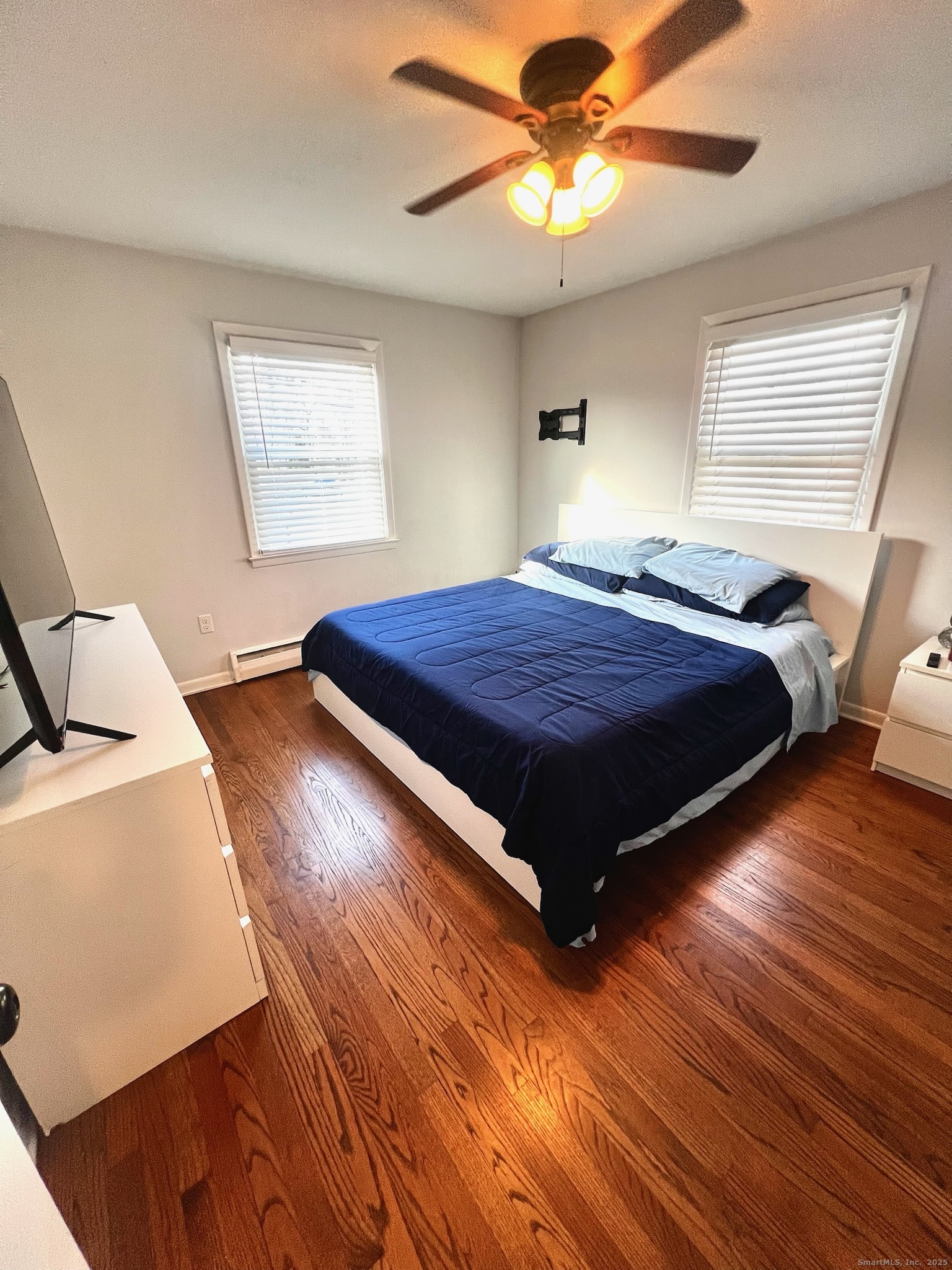 20 Glenfield Avenue Stratford, CT 06614 - Photo 7 of 12 a bedroom with a bed and wooden floor