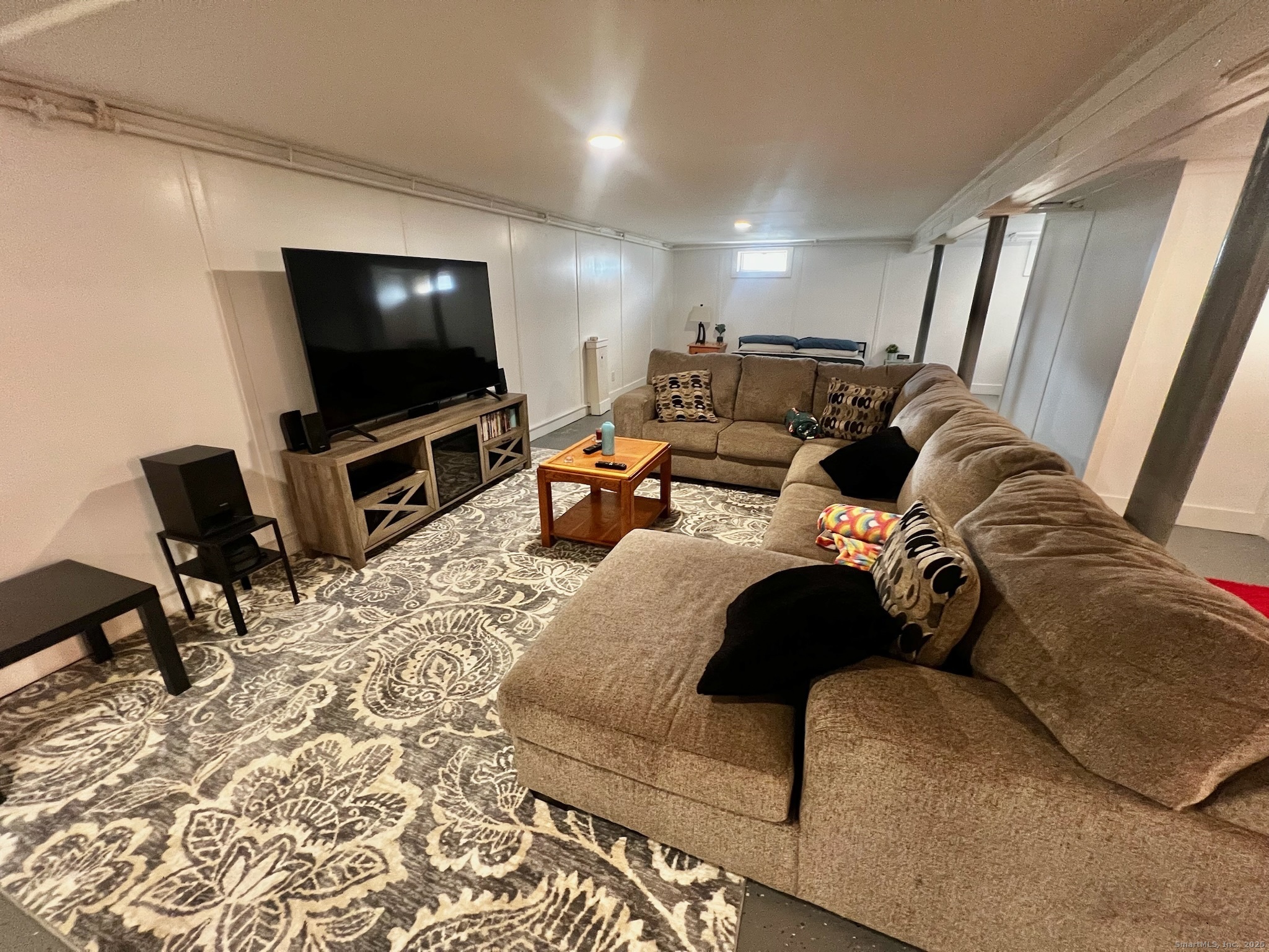 20 Glenfield Avenue Stratford, CT 06614 - Photo 9 of 12 a living room with furniture and a flat screen tv