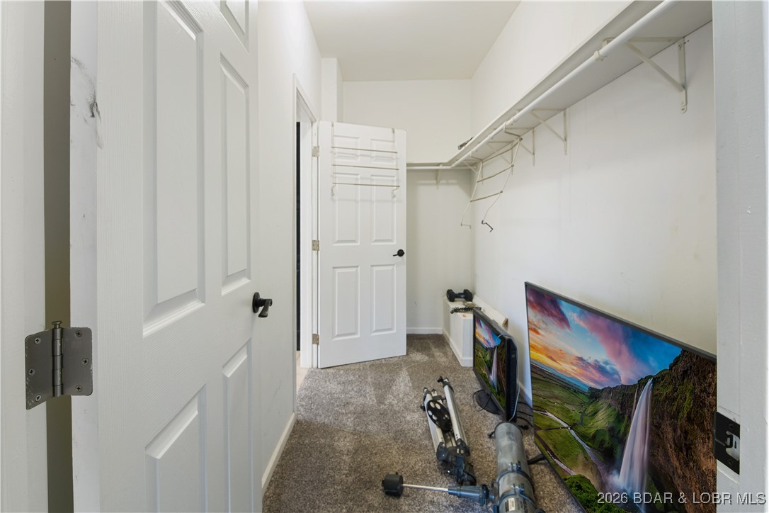 22 Navajo Road Four Seasons, MO 65049 - Photo 21 of 42 Huge walk-in closet ini the primary bedroom.
