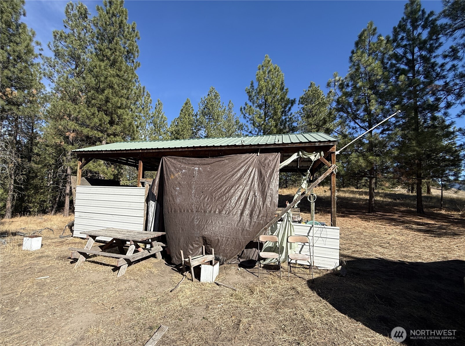 9999 Shade Tree Road Republic, WA 99166 - Photo 20 of 22 a view of a patio with a table and chairs