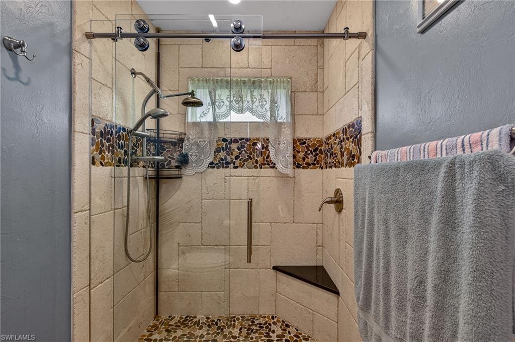 681 St Andrews Boulevard Naples, FL 34113 - Photo 14 of 20 a bathroom with a shower