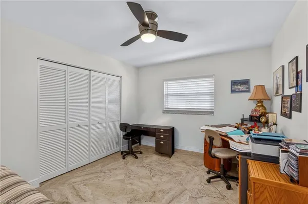 a workspace with furniture and a window