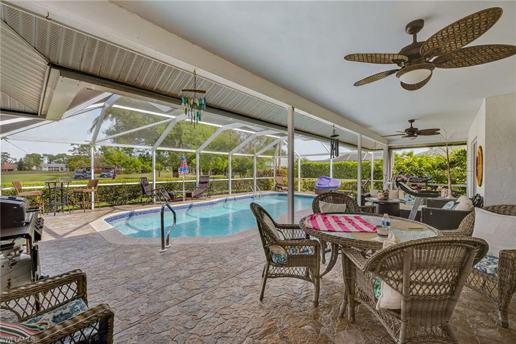 681 St Andrews Boulevard Naples, FL 34113 - Photo 16 of 20 a view of a roof deck with table and chairs