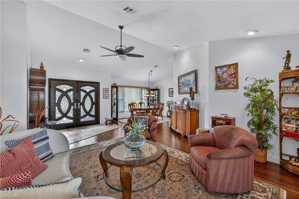 681 St Andrews Boulevard Naples, FL 34113 - Photo 6 of 20 a living room with furniture and a table