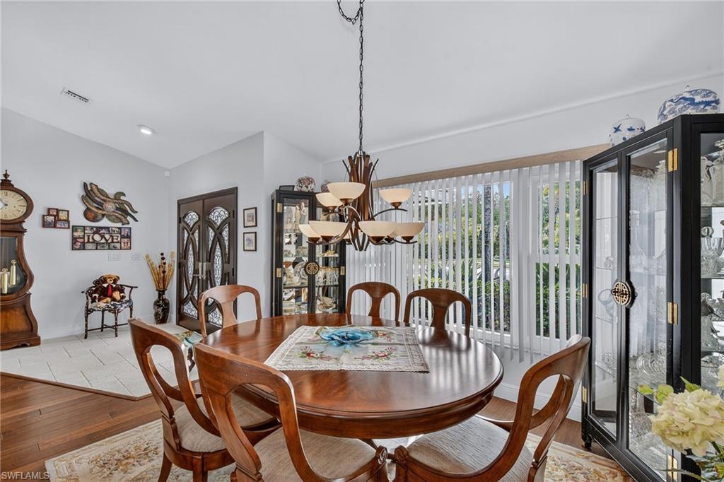 681 St Andrews Boulevard Naples, FL 34113 - Photo 9 of 20 a view of a dining room with furniture window and outside view