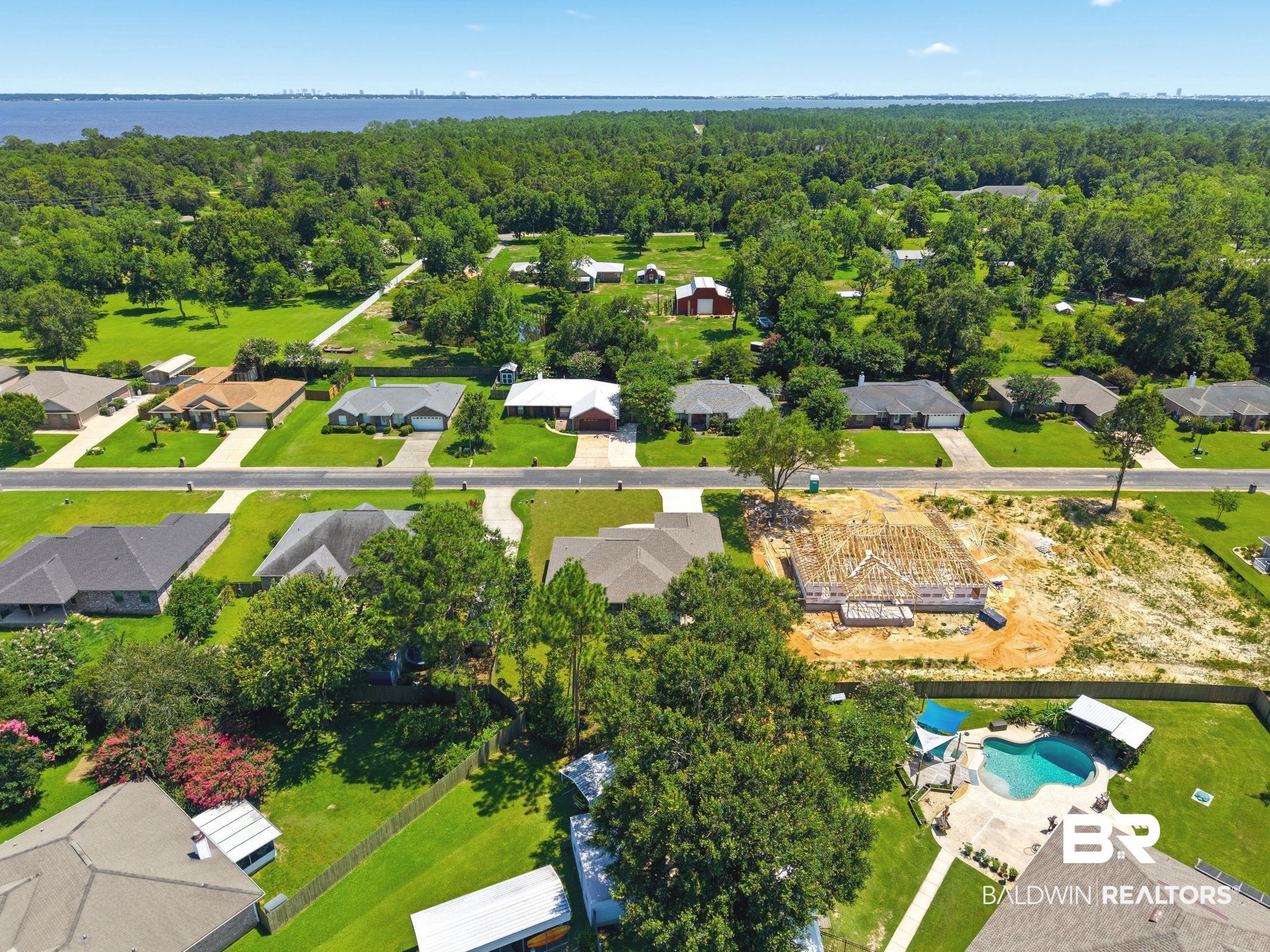 32656 Arbor Ridge Circle Lillian, AL 36549 - Photo 51 of 56 Expansive lot with partial home framing, offering a substantial building footprint