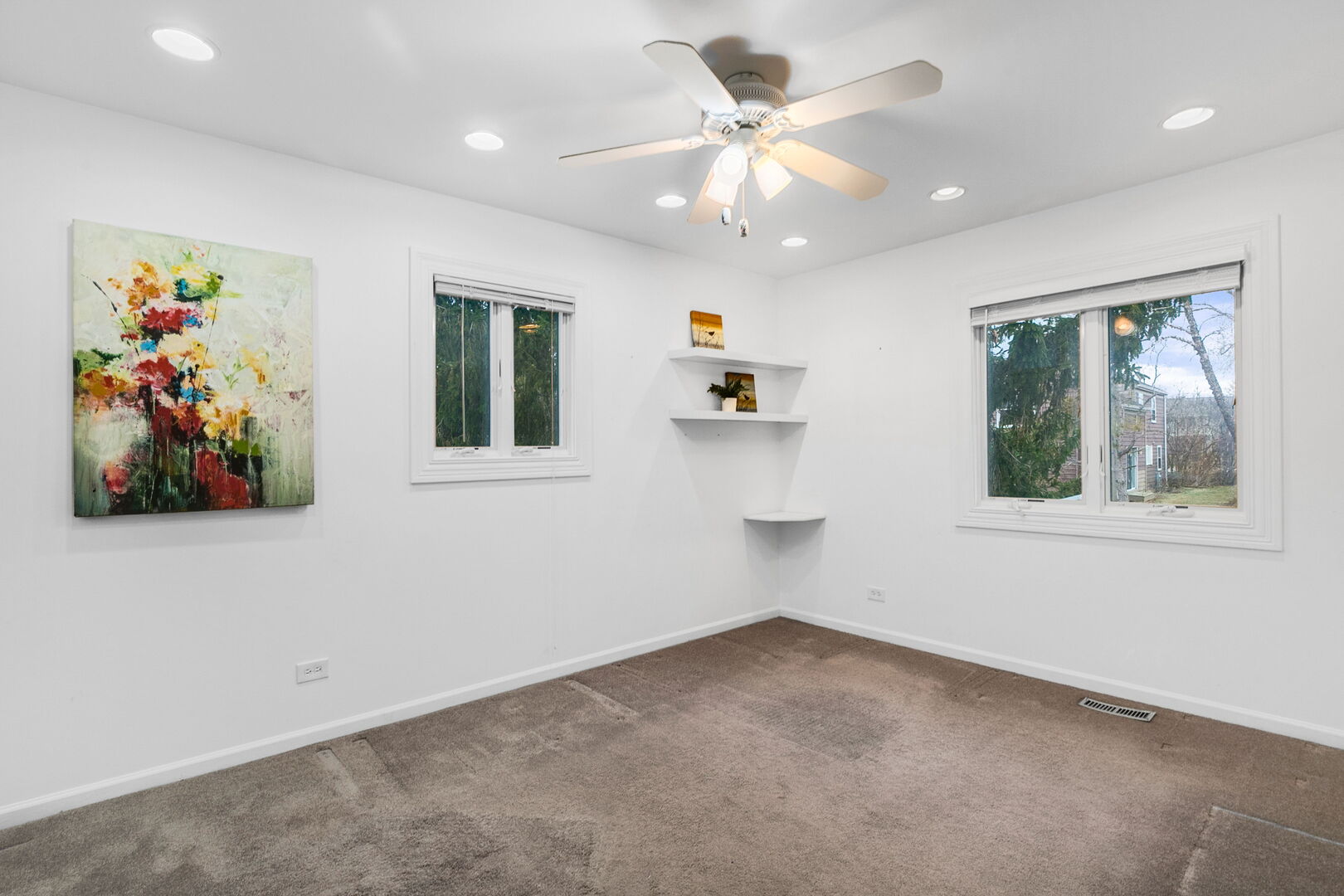 5080 Prairie Oak Road Gurnee, IL 60031 - Photo 9 of 20 an empty room with windows and fan