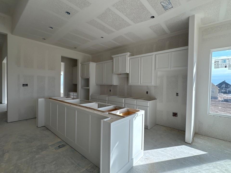 197 Mdw Vista Drive Rhome, TX 76078 - Photo 8 of 13 a kitchen that has a sink and a stove in it
