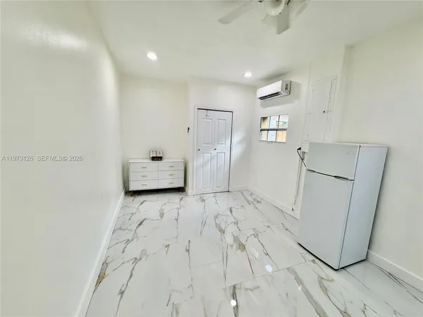 a kitchen with white cabinets
