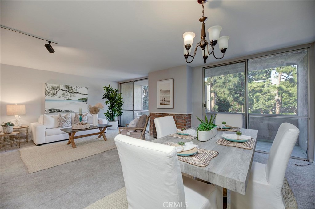 6315 Green Valley Circle, Unit 200 Culver City, CA 90230 - Photo 11 of 40 a living room with fireplace furniture and a large window