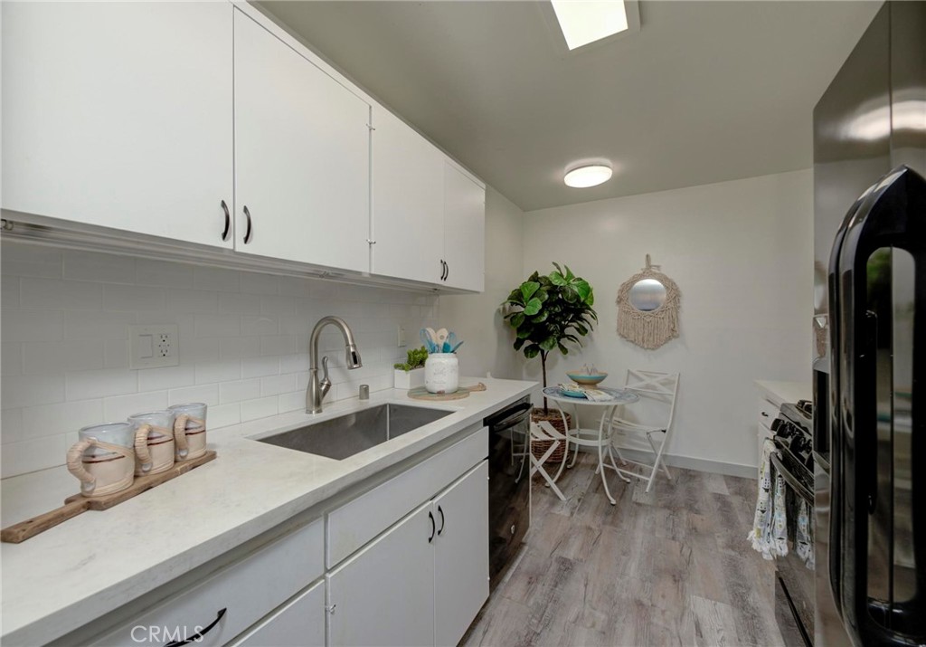 6315 Green Valley Circle, Unit 200 Culver City, CA 90230 - Photo 16 of 40 a kitchen with a sink and cabinets