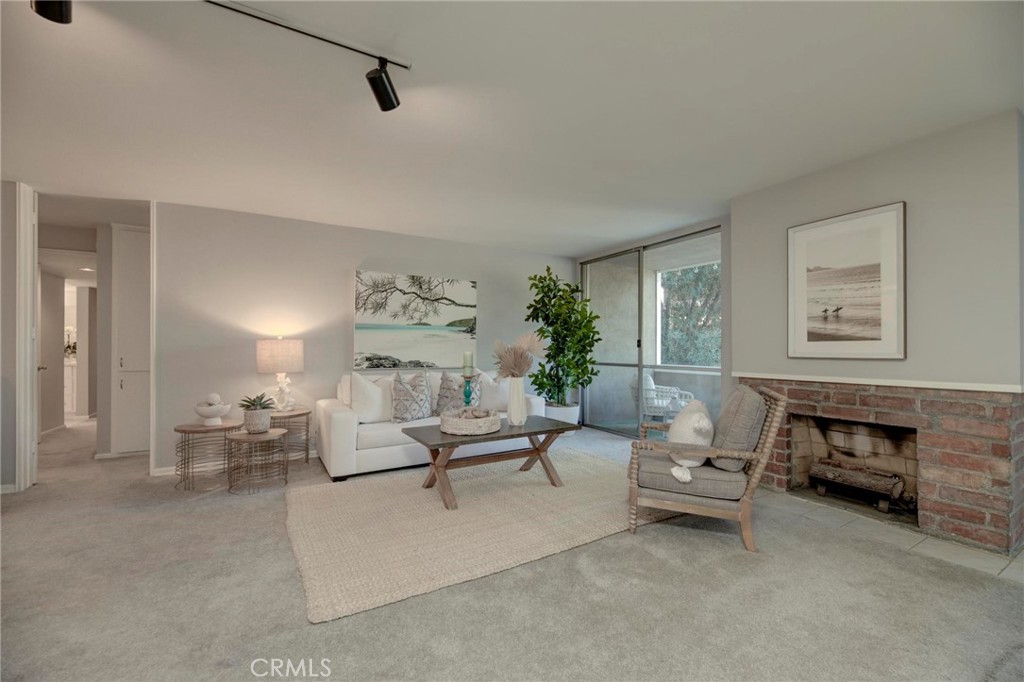 6315 Green Valley Circle, Unit 200 Culver City, CA 90230 - Photo 18 of 40 a living room with furniture and a potted plant