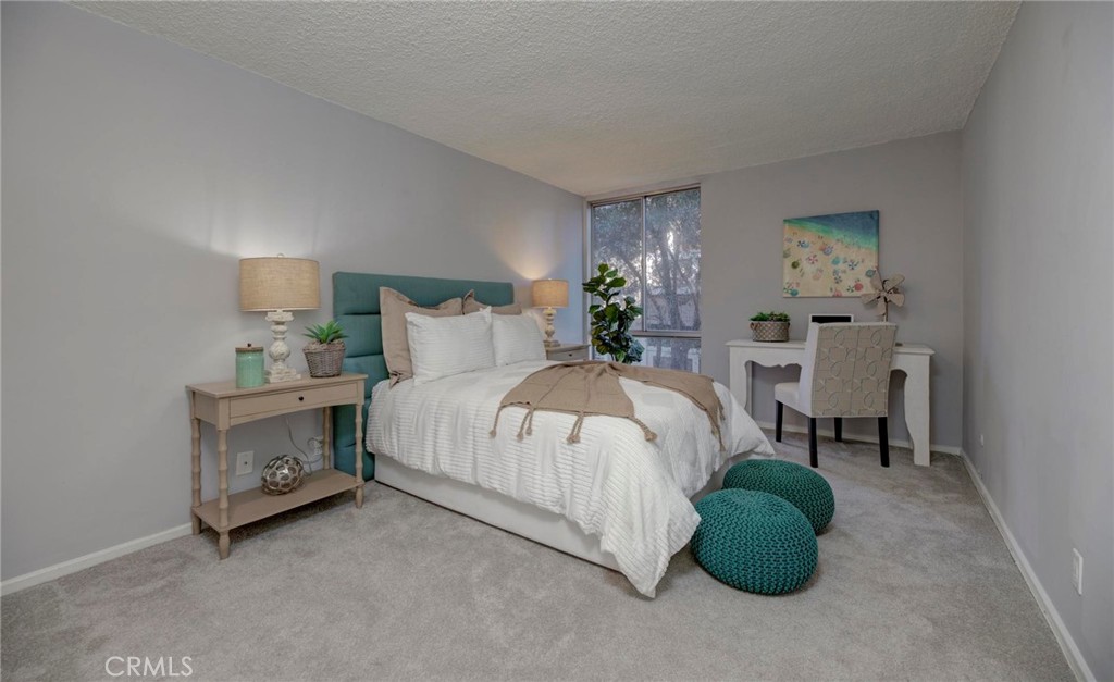 6315 Green Valley Circle, Unit 200 Culver City, CA 90230 - Photo 19 of 40 a bed room with a bed and a chair