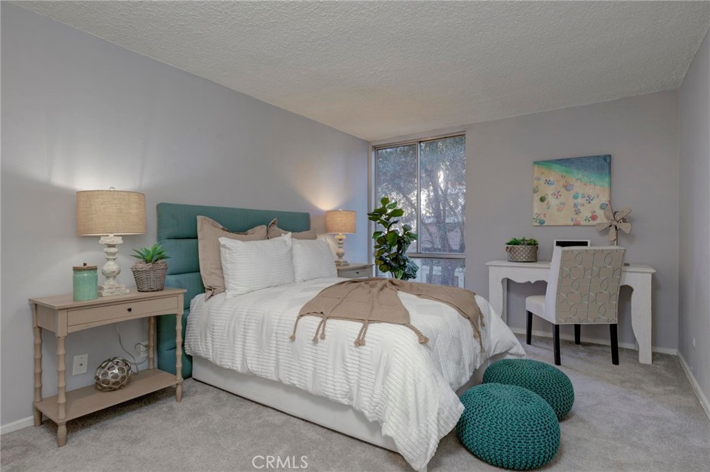 6315 Green Valley Circle, Unit 200 Culver City, CA 90230 - Photo 20 of 40 a bedroom with a bed and a couch