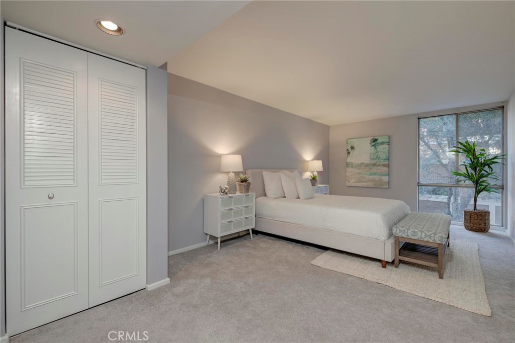 6315 Green Valley Circle, Unit 200 Culver City, CA 90230 - Photo 24 of 40 a bed room with furniture and a potted plant