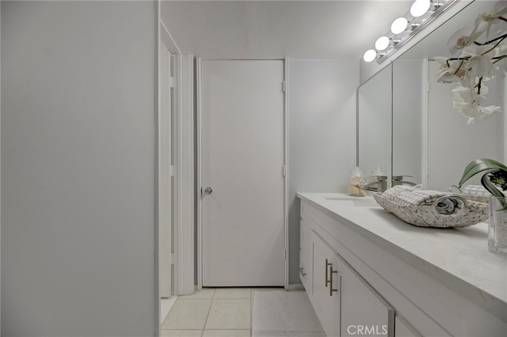 6315 Green Valley Circle, Unit 200 Culver City, CA 90230 - Photo 30 of 40 a bathroom with a sink and a mirror