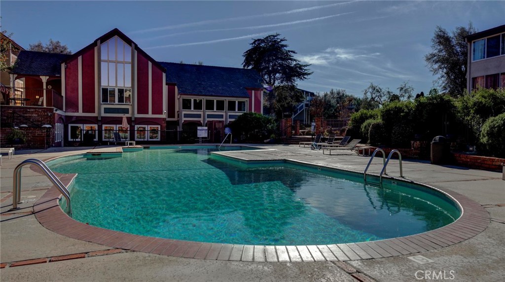 6315 Green Valley Circle, Unit 200 Culver City, CA 90230 - Photo 35 of 40 a swimming pool with outdoor seating and yard