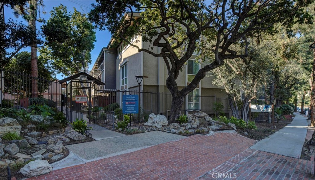 6315 Green Valley Circle, Unit 200 Culver City, CA 90230 - Photo 39 of 40 a pathway of a house with a yard and large trees
