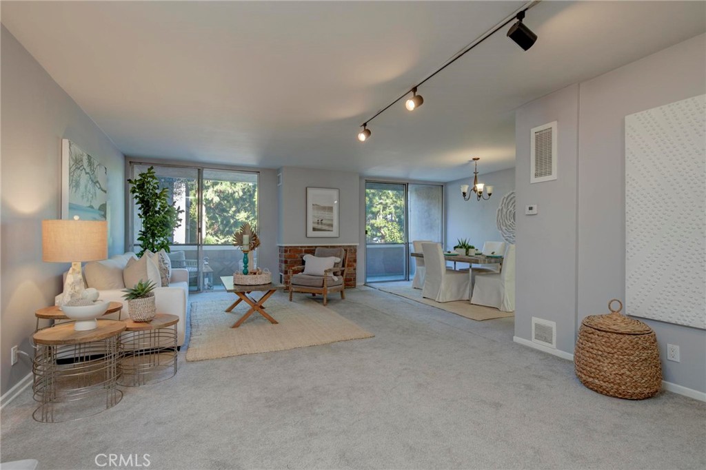 6315 Green Valley Circle, Unit 200 Culver City, CA 90230 - Photo 4 of 40 a living room with furniture and a couch