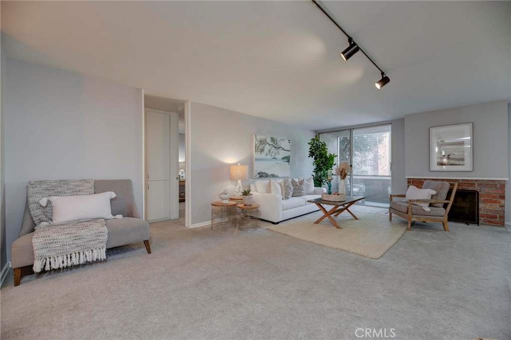 6315 Green Valley Circle, Unit 200 Culver City, CA 90230 - Photo 5 of 40 a living room with furniture and white walls