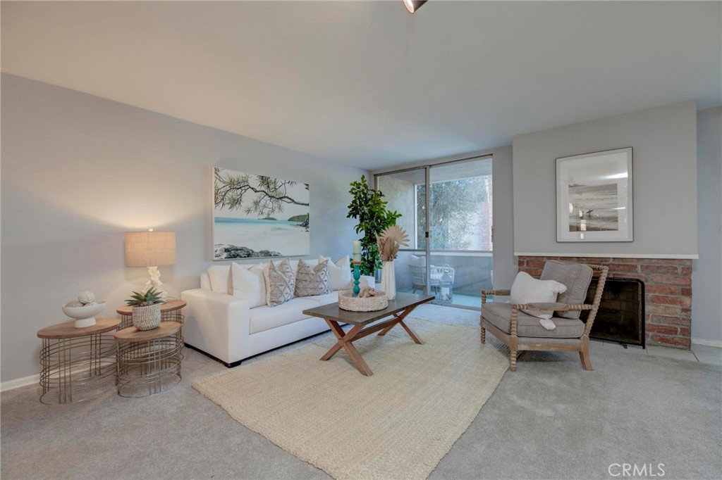 6315 Green Valley Circle, Unit 200 Culver City, CA 90230 - Photo 6 of 40 a living room with furniture and a potted plant