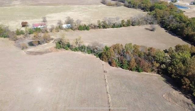 Tbd Jay Road Van Alstyne, TX 75495 - Photo 17 of 28 a view of a dry yard with a house