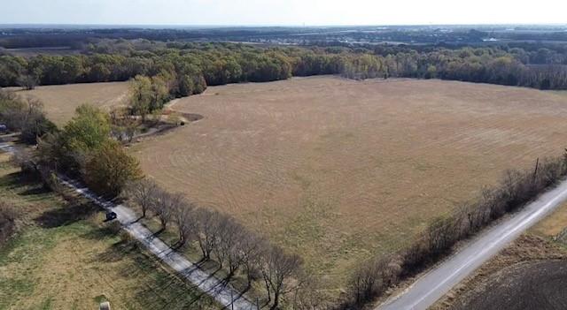 Tbd Jay Road Van Alstyne, TX 75495 - Photo 8 of 28 a view of a dry yard with trees in the background