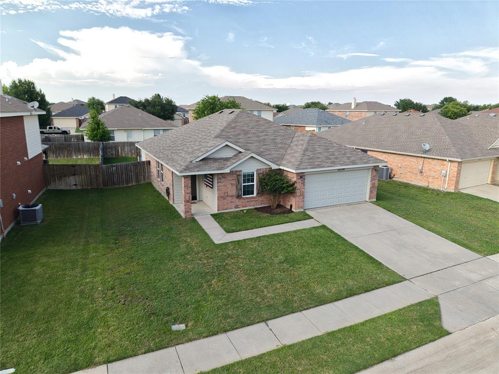 12724 Carpenter Lane Rhome, TX 76078 - Photo 31 of 37 Brick and siding exterior featuring a two-car garage