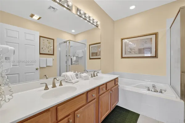 a bathroom with a bathtub and a shower
