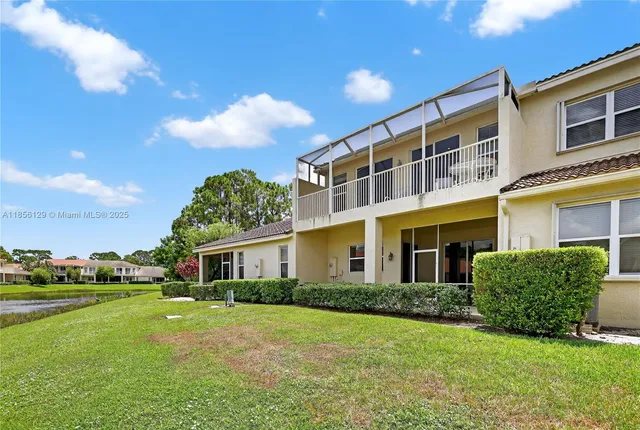 a view of a lake with houses in the background