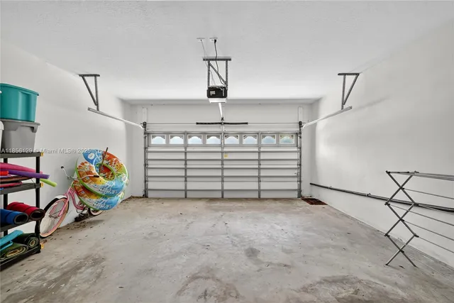 a view of bedroom with furniture and a window
