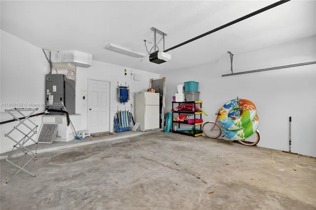 an aerial view of a house with garden space and lake view