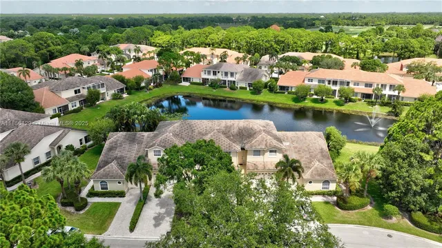 an aerial view of city and lake