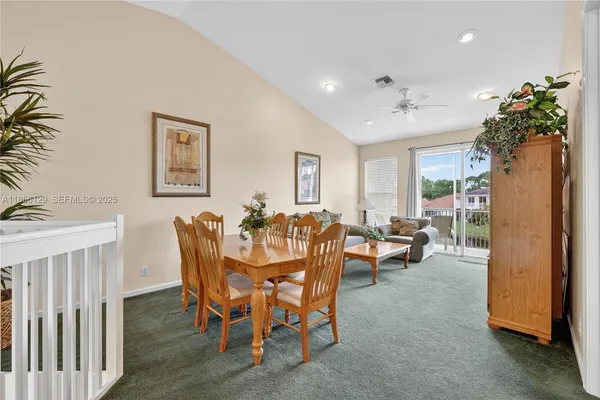 a living room with furniture and a table