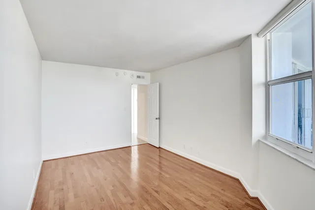 a house with a swimming pool and trees in the background